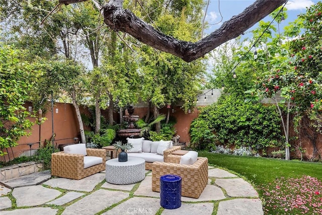 view of patio with a fenced backyard and an outdoor living space