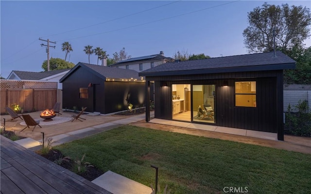 459 E 18th St, Costa Mesa, CA 92627 - back of house with a fire pit, an outbuilding, and a patio