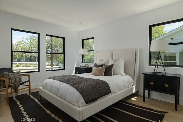459 E 18th St, Costa Mesa, CA 92627 - bedroom with wood finished floors and multiple windows