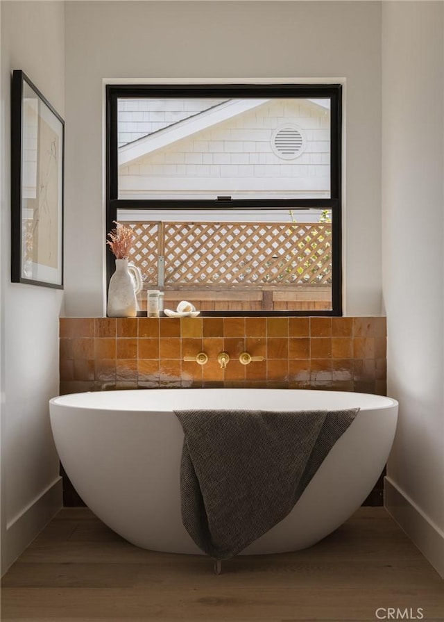 459 E 18th St, Costa Mesa, CA 92627 - full bathroom featuring a soaking tub and wood finished floors