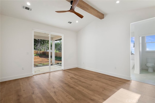 unfurnished room with a ceiling fan, visible vents, and wood finished floors