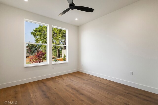 empty room with baseboards, recessed lighting, and ceiling fan