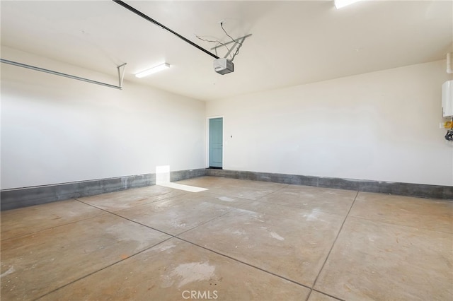 garage featuring baseboards and a garage door opener