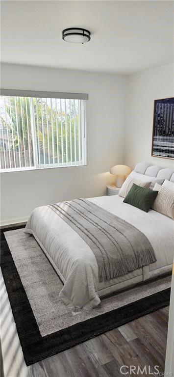 bedroom featuring wood finished floors
