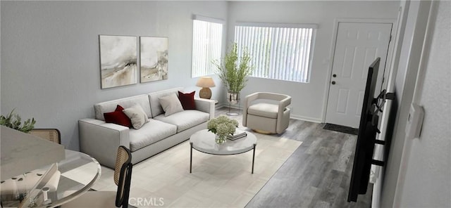 living area with baseboards and wood finished floors