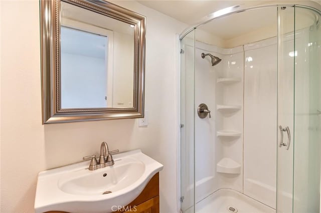 full bath featuring a shower stall and vanity