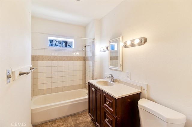 full bath featuring toilet, bathtub / shower combination, and vanity
