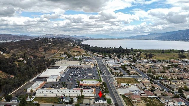 aerial view featuring a water and mountain view