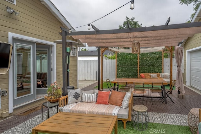 view of patio / terrace featuring a pergola and fence