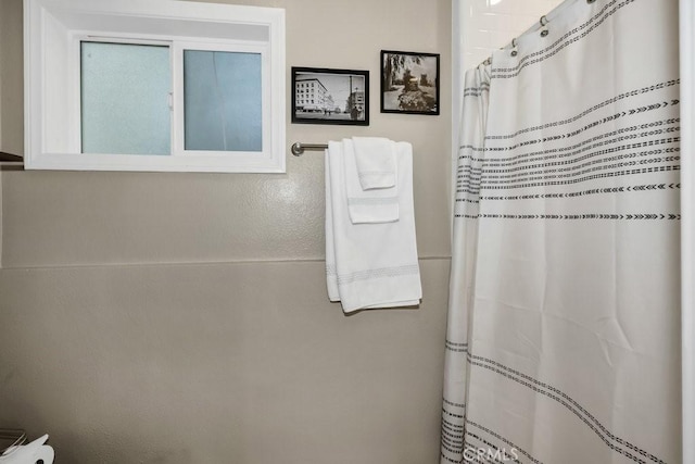 bathroom with a shower with curtain