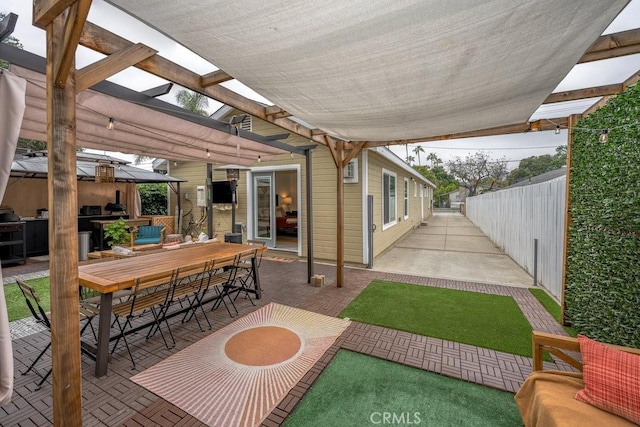 view of patio / terrace with outdoor dining area, fence, and a pergola
