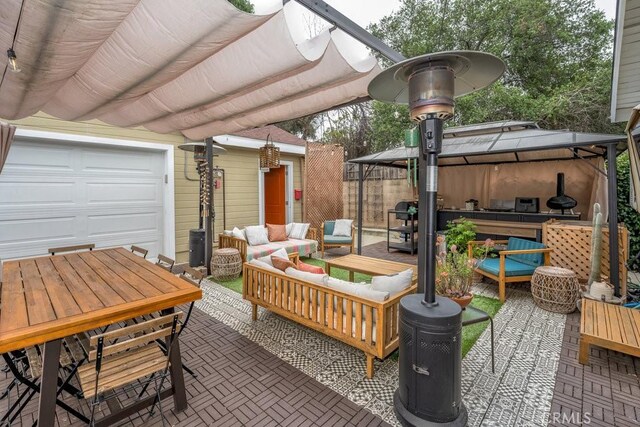 view of patio / terrace featuring a gazebo, outdoor lounge area, and outdoor dining area