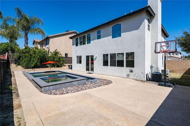 30461 Savoie St, Murrieta, CA 92563 - rear view of property featuring central AC, a fenced backyard, stucco siding, a patio area, and an in ground hot tub