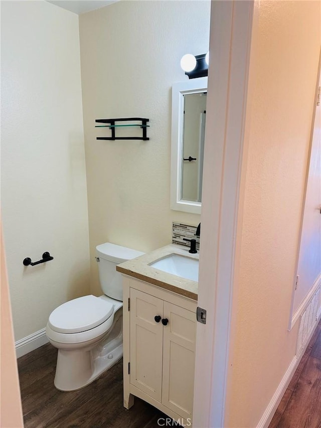4219 La Pinata Unit 255, Oceanside, CA 92057 - bathroom with wood finished floors, toilet, vanity, and baseboards