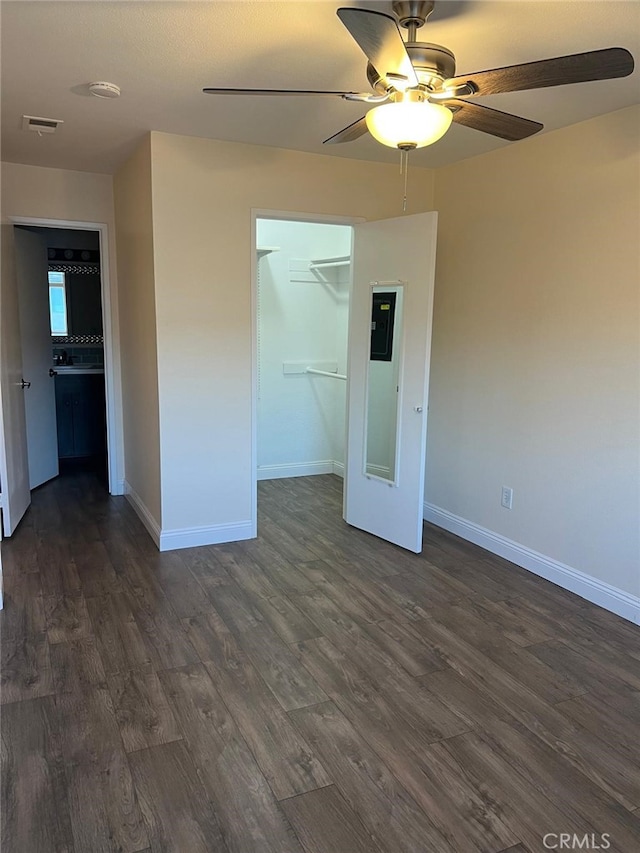 4219 La Pinata Unit 255, Oceanside, CA 92057 - unfurnished bedroom featuring baseboards, dark wood-style flooring, a closet, and a ceiling fan