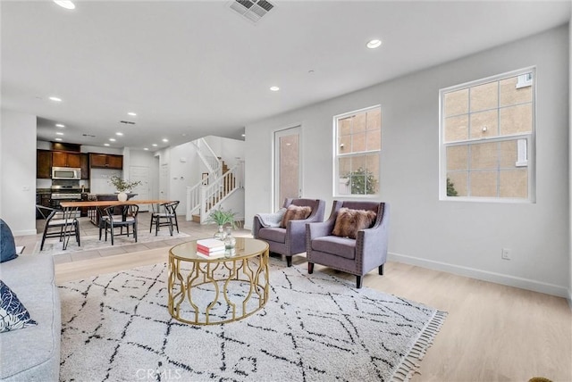 2882 E Via Terrano, Ontario, CA 91764 - living area with stairway, recessed lighting, light wood-style flooring, and baseboards