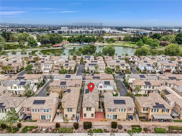 aerial view with a water view and a residential view