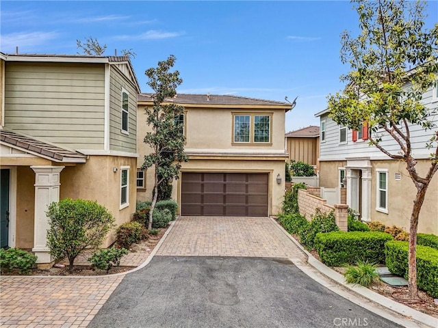 2882 E Via Terrano, Ontario, CA 91764 - multi unit property with a garage, driveway, and stucco siding