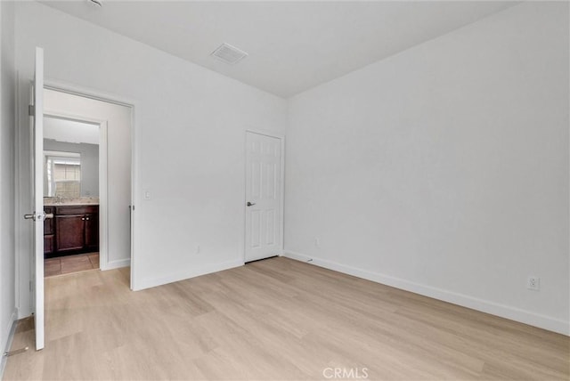 2882 E Via Terrano, Ontario, CA 91764 - unfurnished bedroom with light wood-type flooring and baseboards
