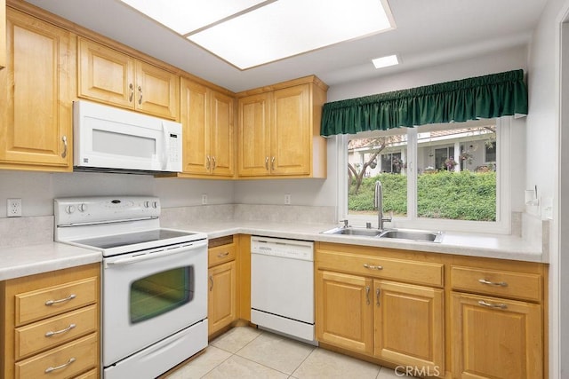 kitchen featuring light countertops, light tile patterned flooring, a sink, and white appliances