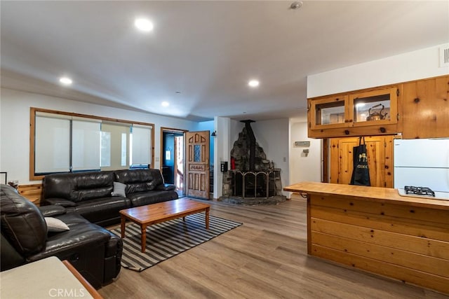 41505 Alder Dr, Forest Falls, CA 92339 - living room featuring visible vents, wood finished floors, recessed lighting, and a wood stove