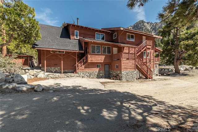 41505 Alder Dr, Forest Falls, CA 92339 - back of house featuring roof with shingles, stairs, and a mountain view