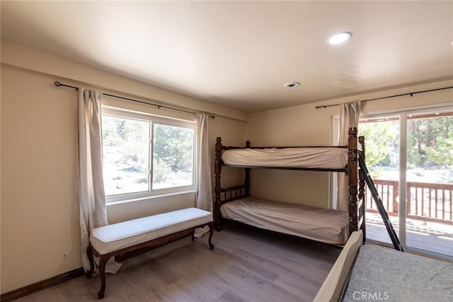 41505 Alder Dr, Forest Falls, CA 92339 - bedroom featuring recessed lighting, multiple windows, wood finished floors, and access to outside