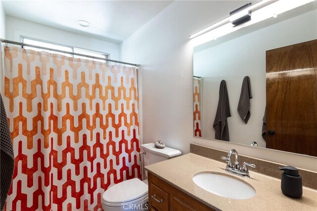 26704 Raven Rd, Wrightwood, CA 92397 - full bath featuring vanity, a shower with curtain, and toilet