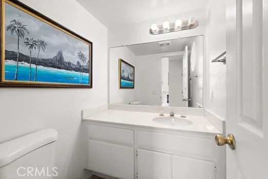 bathroom with vanity and toilet