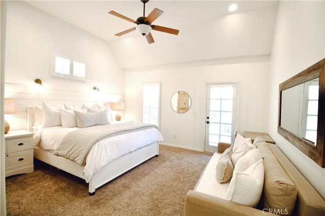 carpeted bedroom featuring vaulted ceiling, a ceiling fan, and baseboards