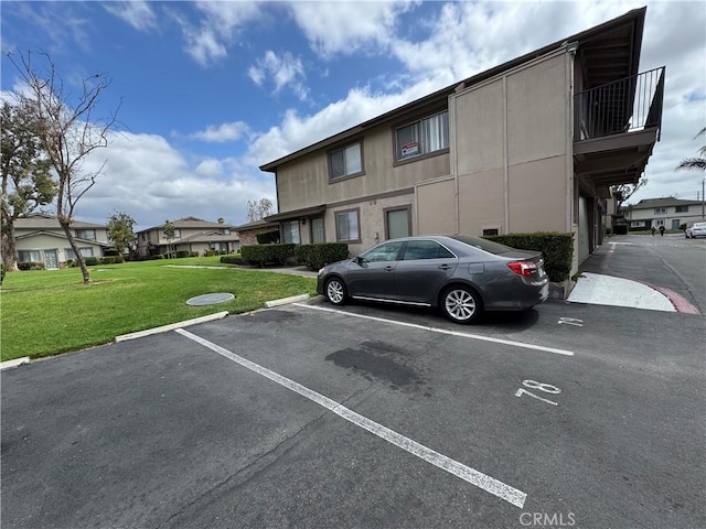 1709 Normandy Pl Unit B, Santa Ana, CA 92705 - uncovered parking lot featuring a residential view
