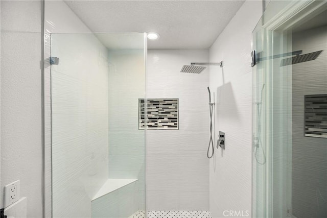 full bathroom featuring a shower stall