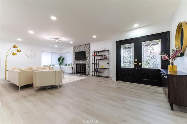 entrance foyer featuring french doors, recessed lighting, and light wood-style floors