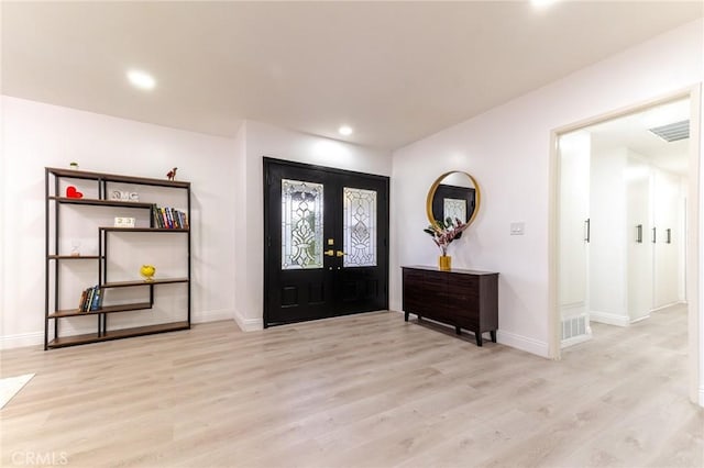 entryway featuring french doors, visible vents, baseboards, recessed lighting, and wood finished floors