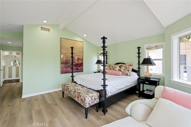 bedroom featuring visible vents, lofted ceiling with beams, baseboards, recessed lighting, and wood finished floors