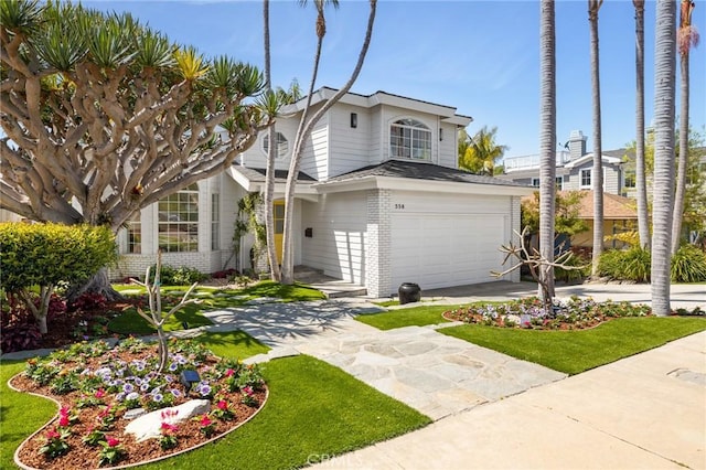 traditional-style house featuring concrete driveway and brick siding