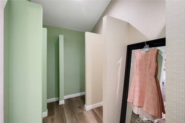 bathroom with wood finished floors and baseboards