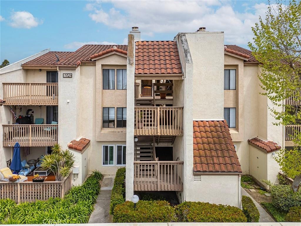 16542 Blackbeard Ln Unit 102, Huntington Beach, CA 92649 - view of building exterior featuring stairs