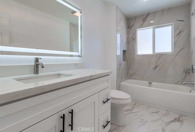 bathroom with vanity, toilet, marble finish floor, and bathing tub / shower combination