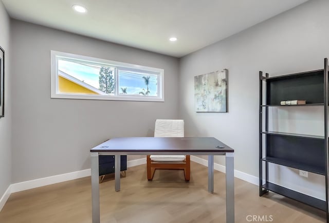 office space with recessed lighting, light wood-style flooring, and baseboards
