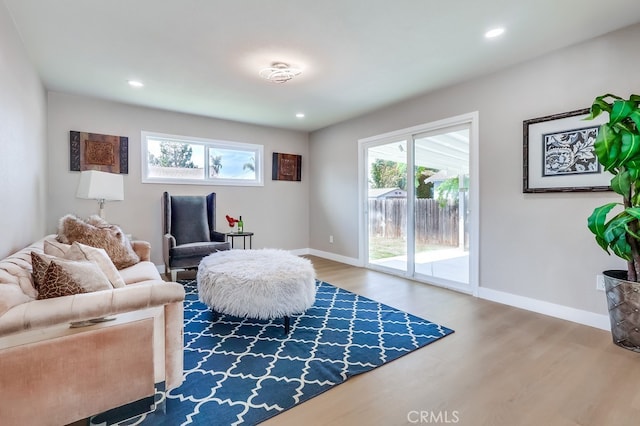 sitting room featuring wood finished floors, recessed lighting, and baseboards