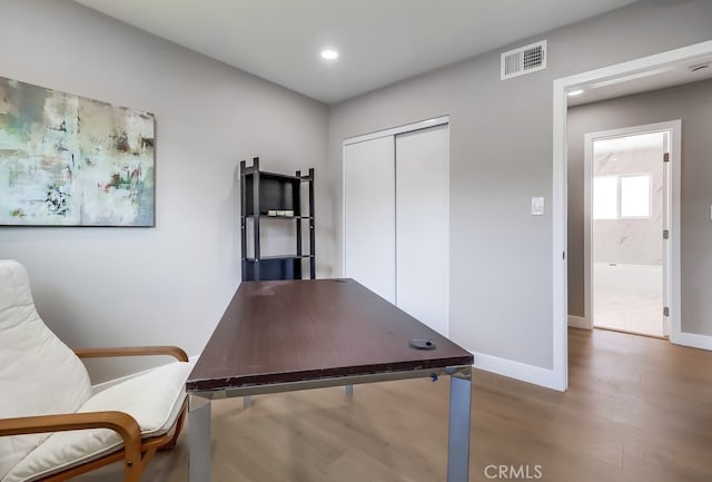 office area featuring wood finished floors, visible vents, recessed lighting, and baseboards