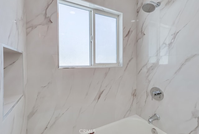 full bath with a healthy amount of sunlight and tub / shower combination