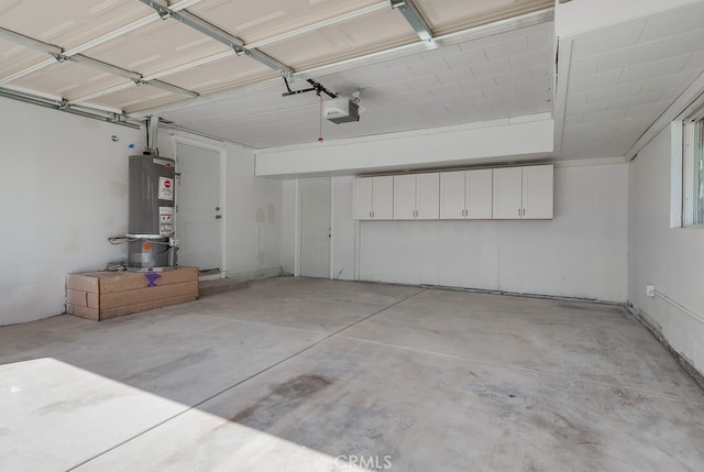 garage featuring water heater and a garage door opener