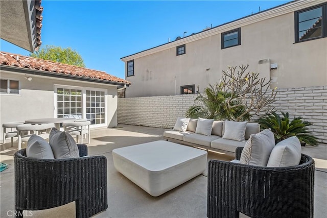view of patio with fence and an outdoor hangout area