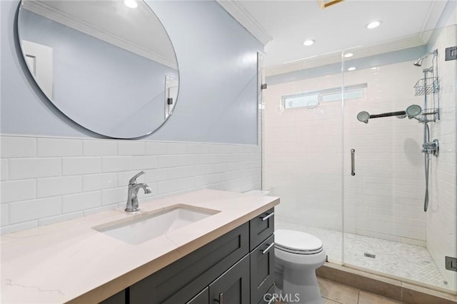 full bath with ornamental molding, tile walls, toilet, and a shower stall