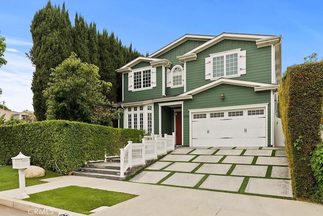 view of front of property featuring driveway, an attached garage, and board and batten siding