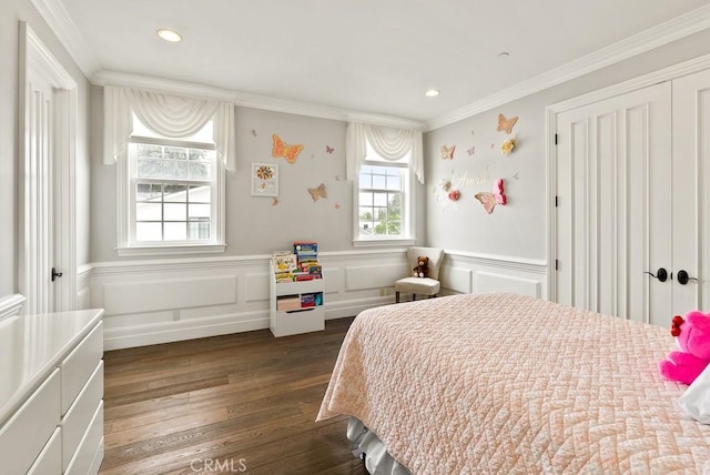 bedroom featuring crown molding, recessed lighting, a wainscoted wall, and dark wood finished floors