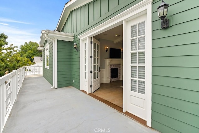 view of exterior entry with board and batten siding
