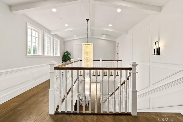 interior space featuring lofted ceiling with beams, a wainscoted wall, a decorative wall, hardwood / wood-style floors, and recessed lighting